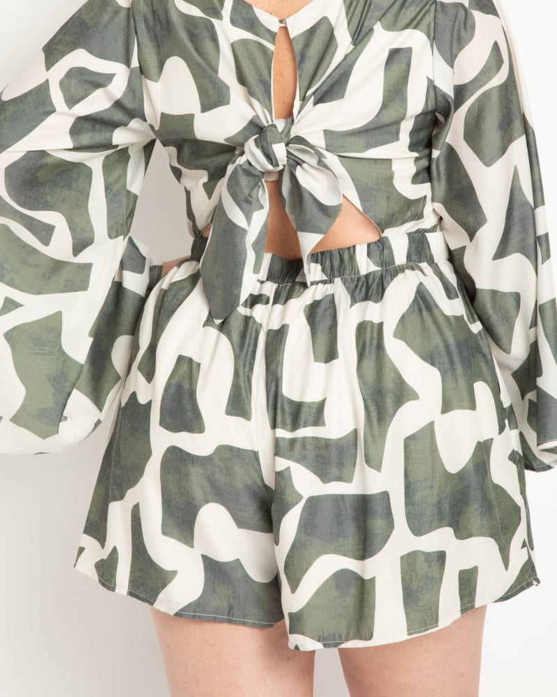Back of a model wearing a size 16 Romper With Tie Back in Sand Blocks - Green by ELOQUII. | dia_product_style_image_id:295308
